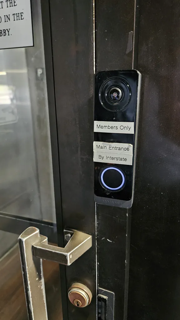 Video intercom at the Kinected Coworking members entrance labeled Members Only