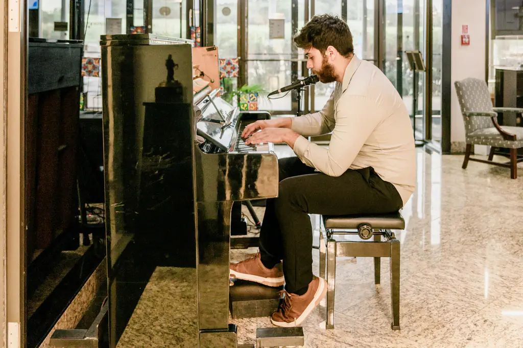 Live piano music in the lounge during an evening event at Kinected Coworking