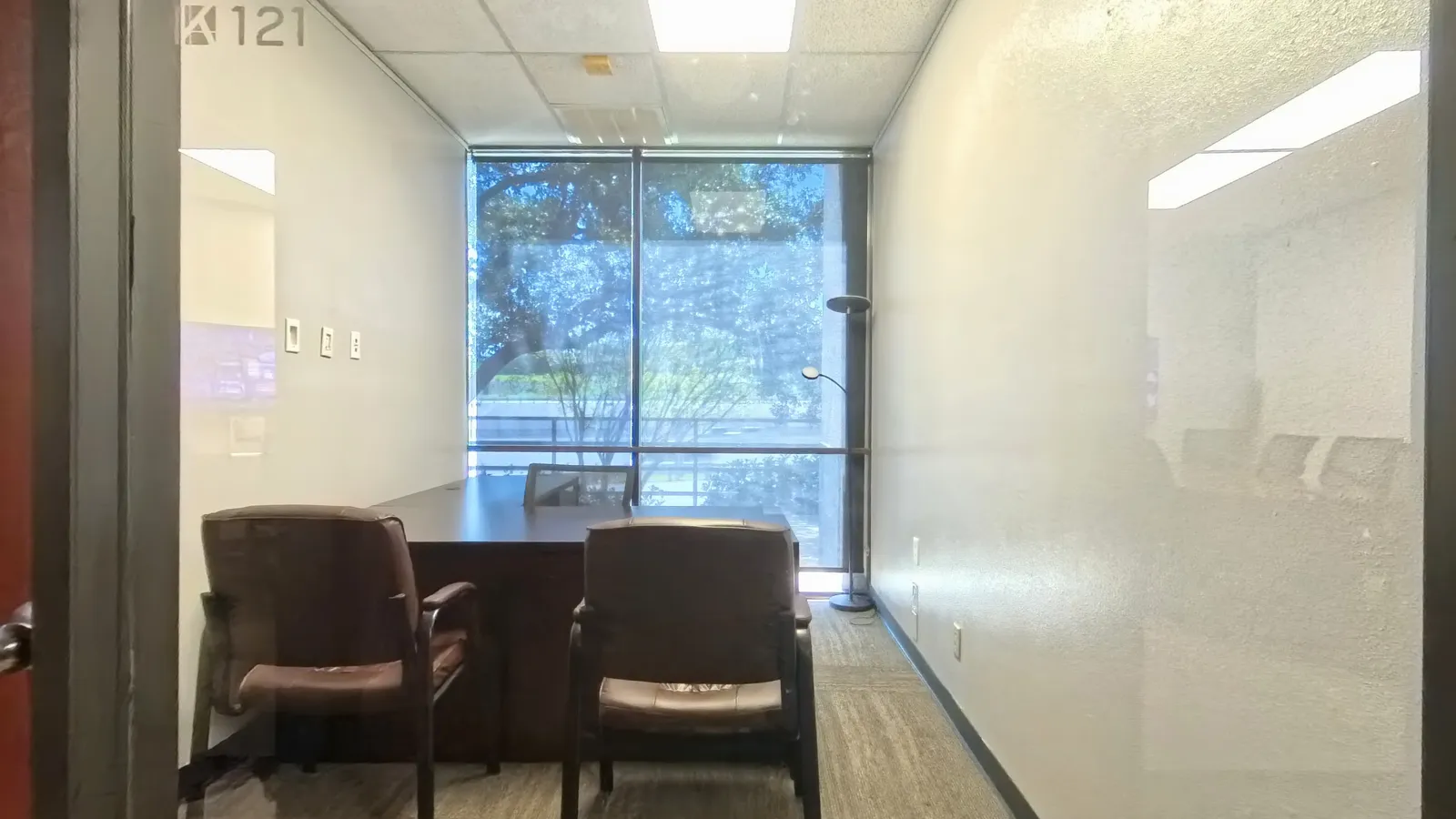 Room 121 private office windows facing the USAA campus