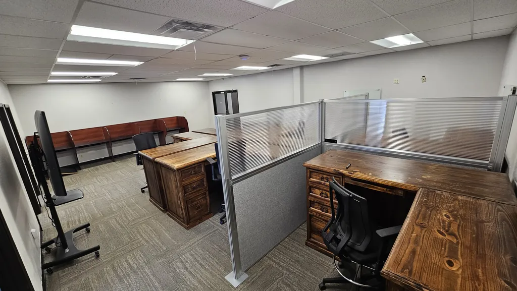 Partitioned L-shaped workstations and a row of study carrels in Suite 211