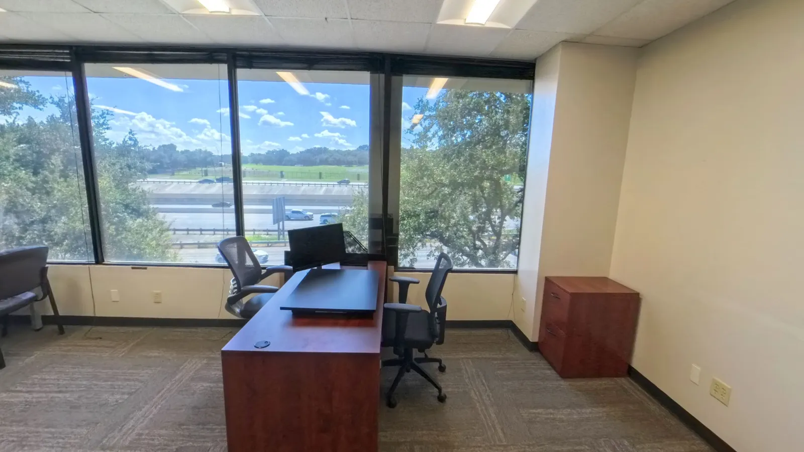Room 217 private office at Kinected Coworking with desk and natural light