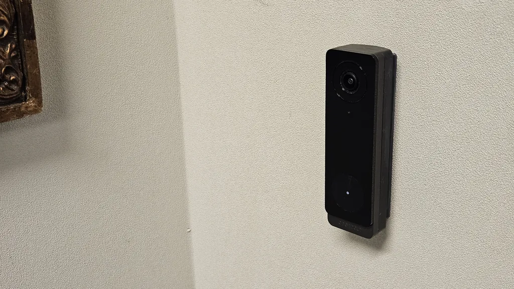 Camera-equipped access reader beside the Suite 221 entrance