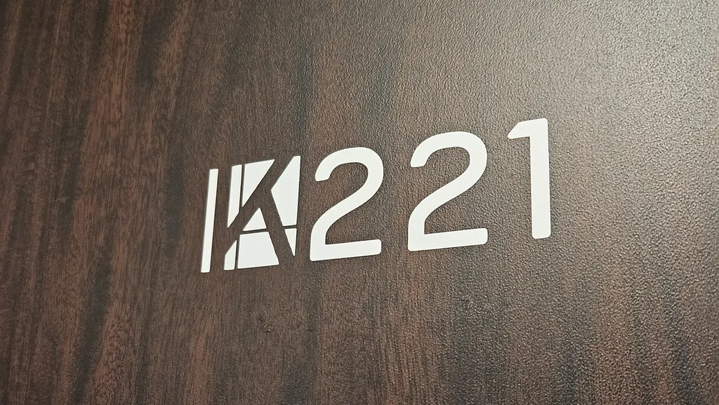 Room 221 suite number on the private office door at Kinected Coworking in San Antonio